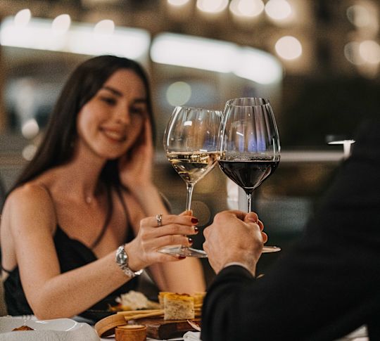 Couple toasting with wine glasses