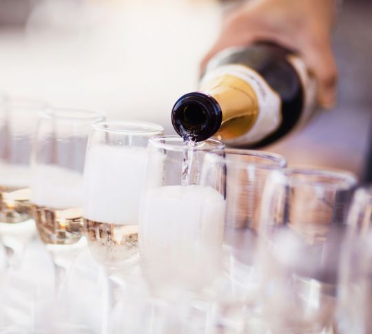 Champagne being poured into glasses