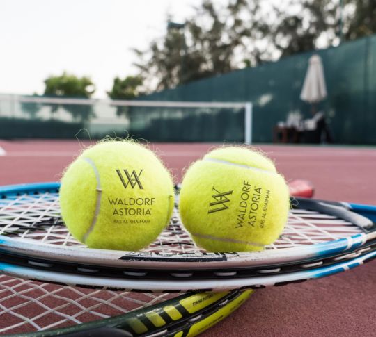 Shot of tennis balls on racket