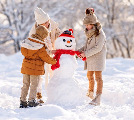 Family Making a Snowman