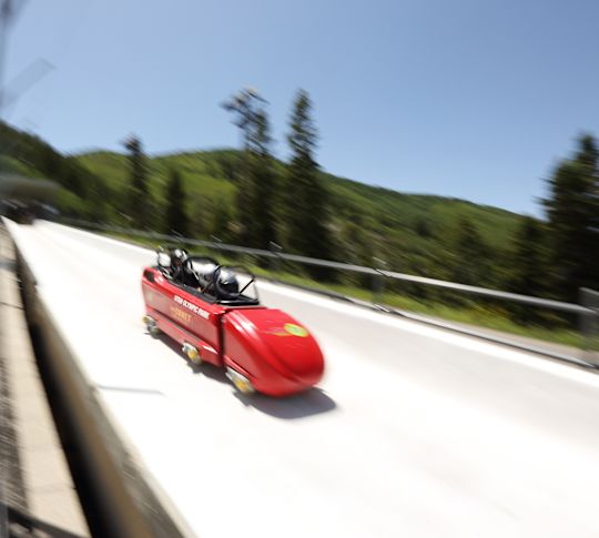 People Riding in a Snowmobile