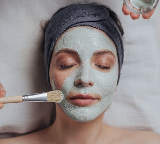 Woman receiving facial