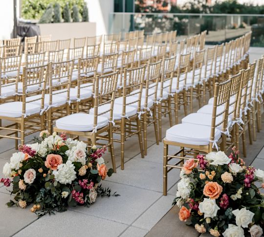 Terrace with  Flowers and Chairs Setup Theater Style to Celebrate a Wedding