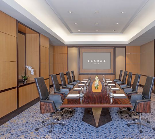 Boardroom with TV and Sitting for Ten Guests at Conrad Dubai