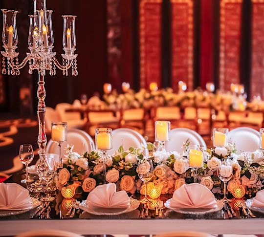 table set formally with flowers and candles