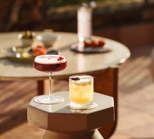 Cocktails on a Table at Bar Bollicine-transition