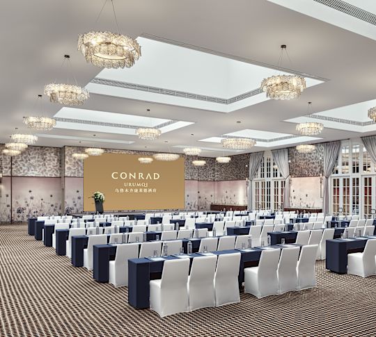 Classroom with tables, chairs and projector screen