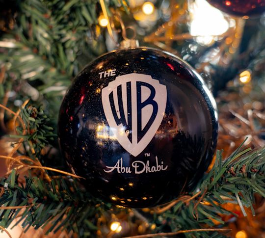 holiday tree ornament with The WB Abu Dhabi text