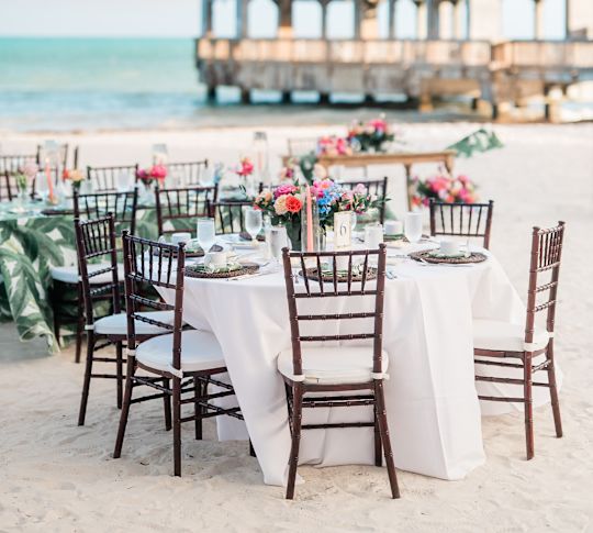 Tables and chairs with wedding setup