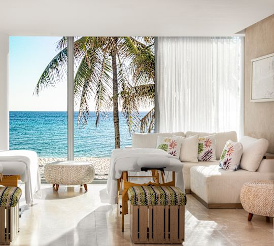 Okyanus manzarasına bakan masaj masalı spa bakım odası