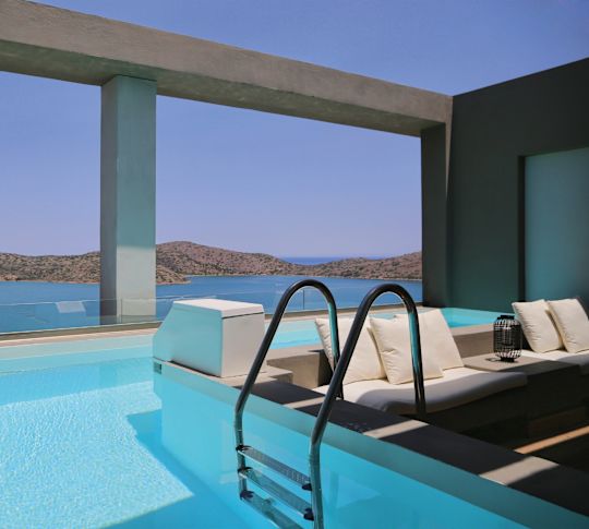 Sapphire Zen suite's pool with sunken seating area and a sea view.