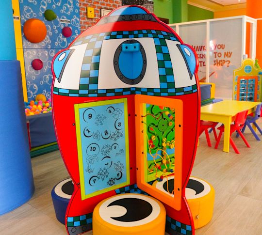 Kids play area with colorful tables and chairs