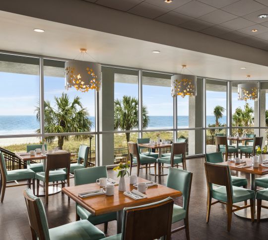 Bright on-site restaurant with stunning ocean views