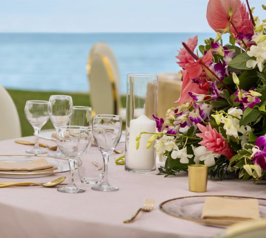 Close View of a Table Setup with Flowers Outdoors for a Celebration