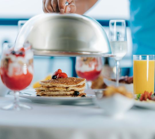 Room Service with Orange Juice Pancakes with Berries