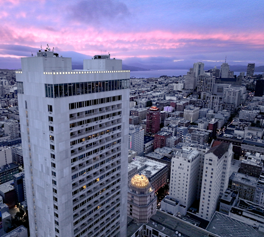 Aerial View of a Hotel Exterior in a Large City at Dawn