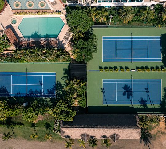 aerial view of tennis courts and outdoor pool