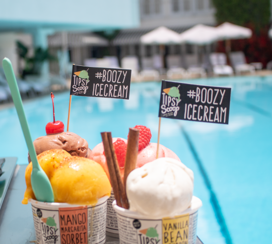 Alcoholic Ice Creams in tubs next to pool