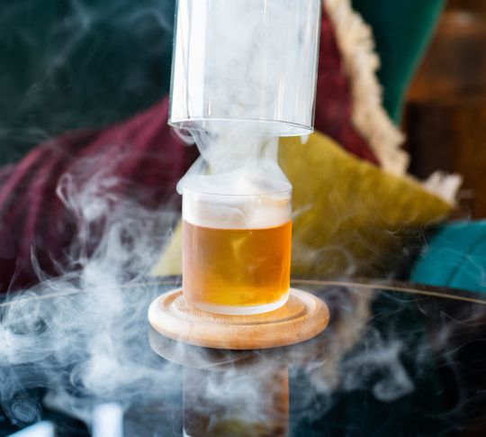 Close-up of cocktail with mist coming of it
