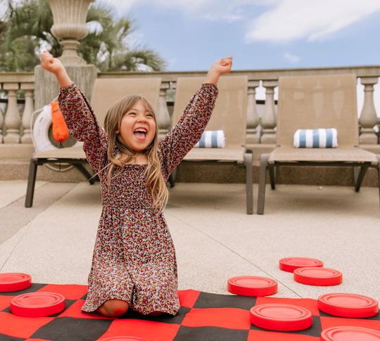 kid playing outdoor game