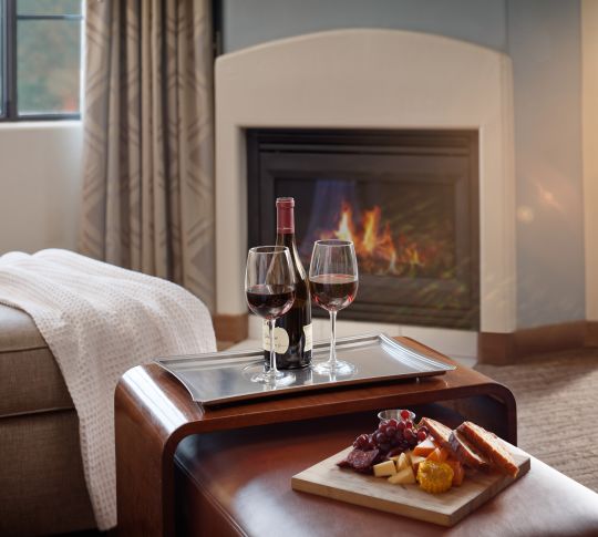Guestroom Interior with Wine Tray and Fireplace