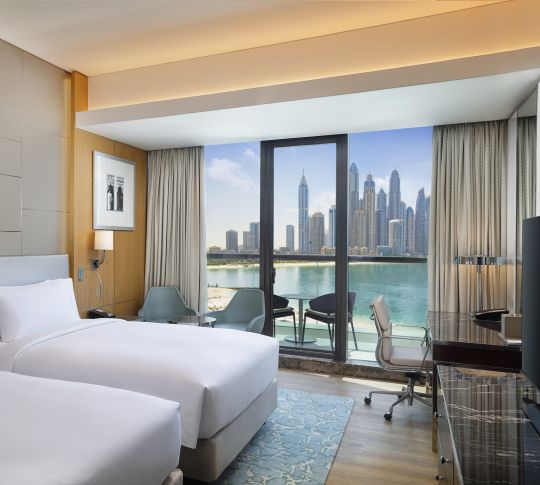 Twin beds room with view of marina