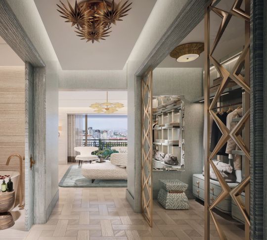 Kleiderschrank und Wohnbereich der Suite mit Blick auf die Bucht