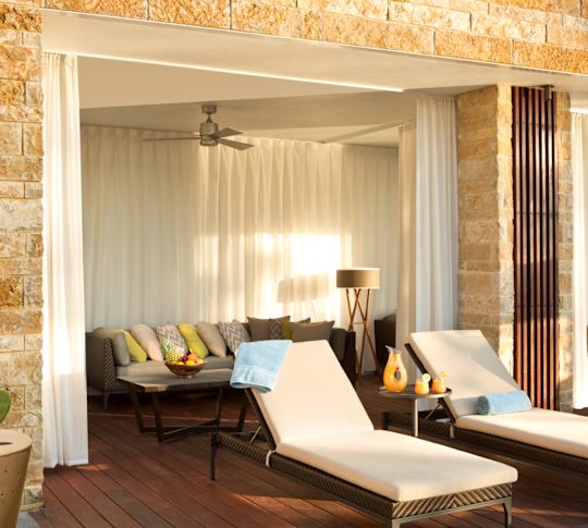 Cabanas by adult-only outdoor swimming pool