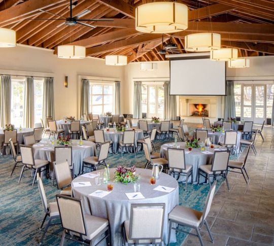 Palo Duro meeting room set up with round tables and chairs