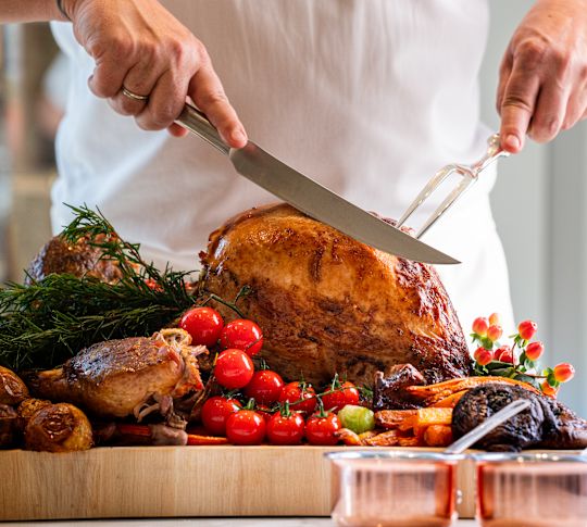 Tribeca Market , chef carving a turkey