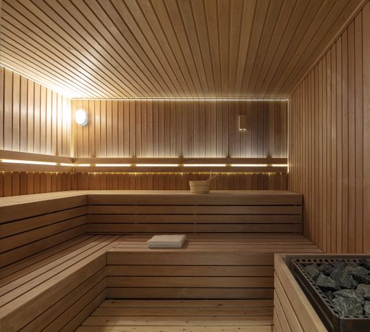 sauna with towel and stones