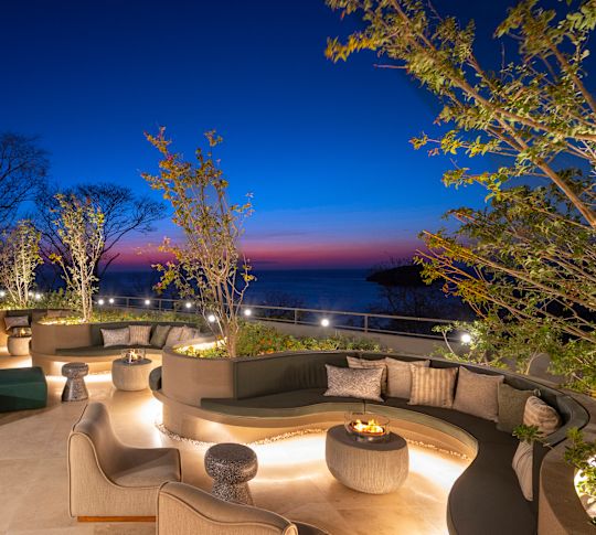 The Terrace Restaurant Terrace with Fire Pits at Night