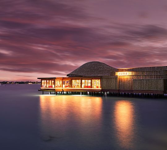 Exterior View of Zuma Restaurant on the Water at Sunset