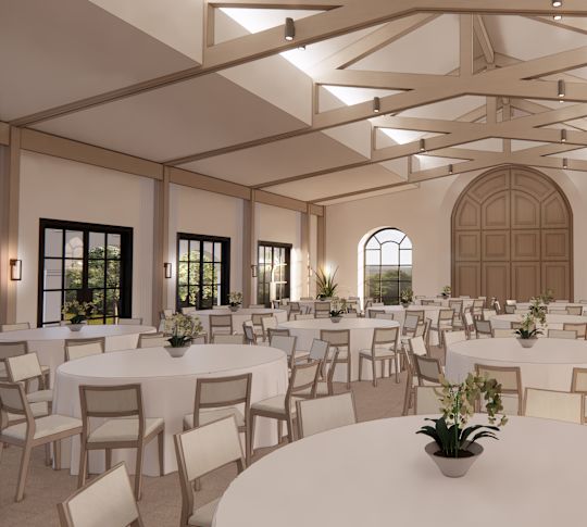 The Calera event space with vaulted ceiling, windows, and round tables