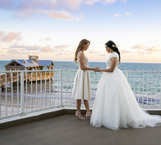 Brides Outside Balcony at Sunset