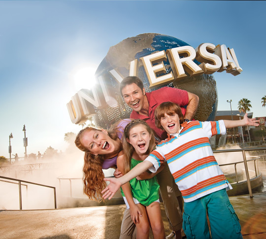 Family in front of Universal Family Globe