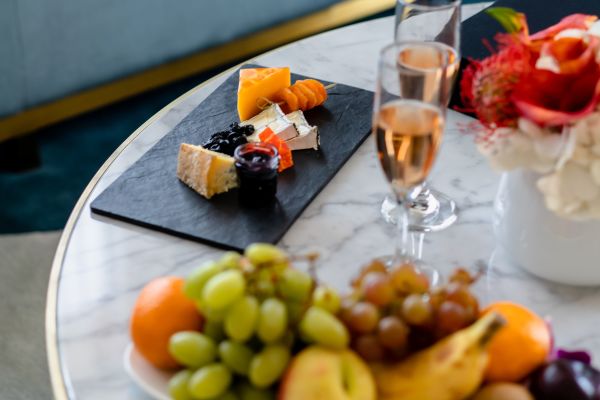 Champagne with cheese board and fruit