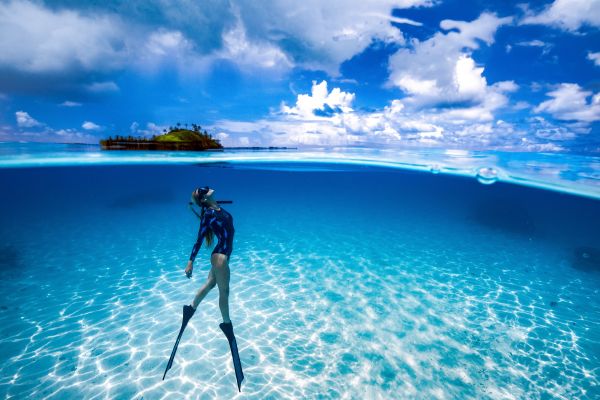 Shot of woman diving underwater