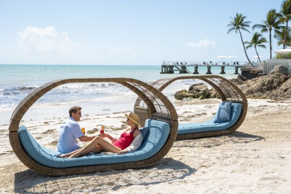 Couple on the Beach in Lounge Chair