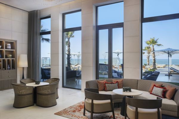 Comfortable Sofa in Hotel Lobby with View of Outdoor Terrace