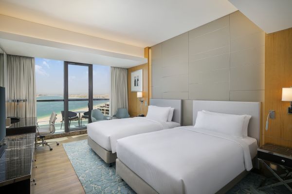 Twin beds room with view of beach
