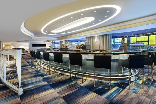 Bridges Bar in Oval Setting with Black Chairs