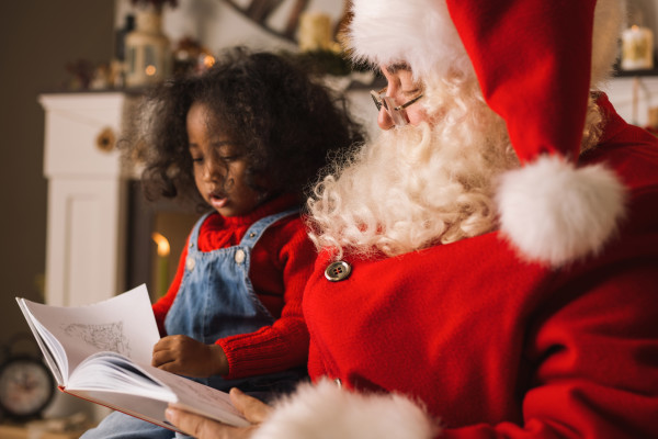 Christmas - Santa reading with little girl
