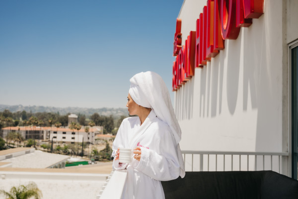 Woman in robe on balcony