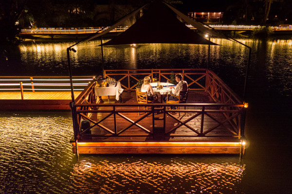 A Couple Having Dinner on a Floating Platform
