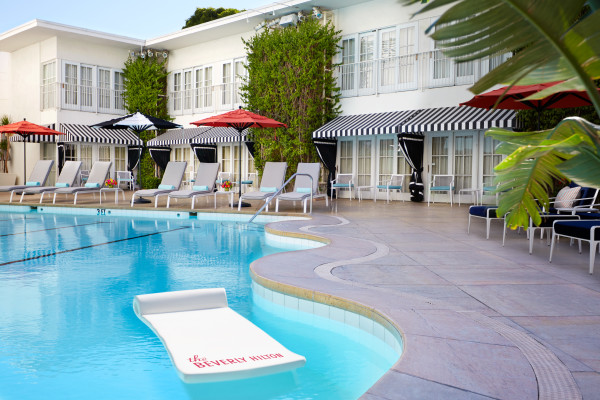 Outdoor Pool with Lounge Chairs and Umbrellas