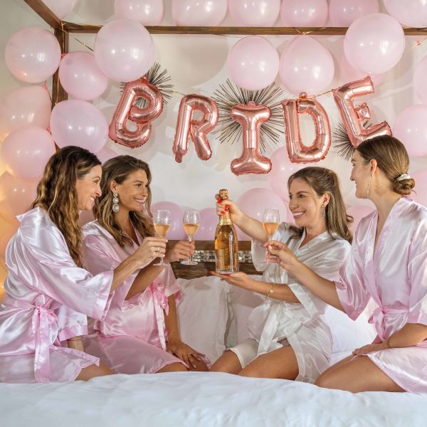 Bridesmaids in bedroom shot