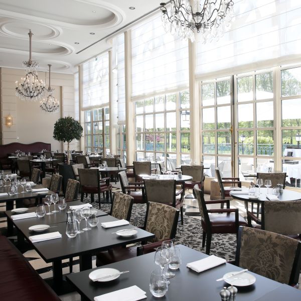 Tables and chairs in La Veranda by Gordon Ramsay