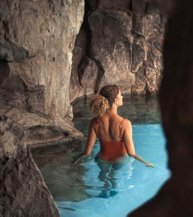 Woman Enjoying Pool Cave
