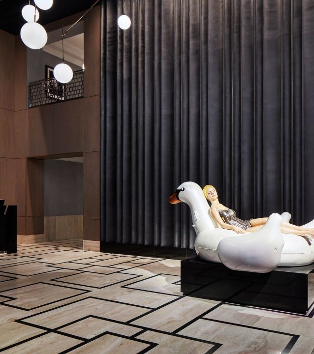 Lobby area with statue of woman on swan